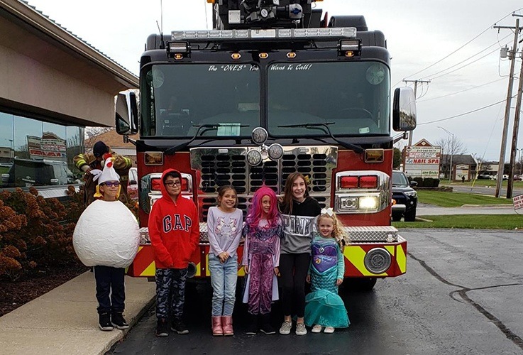 Kids in front of fire truck