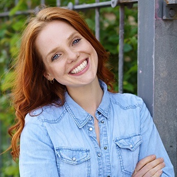 Woman sharing aligned smile after Invisalign
