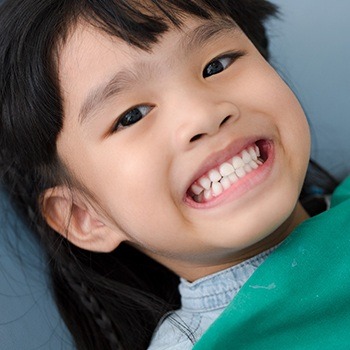 Child smiling during dental checkup