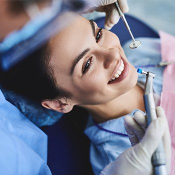 Woman receiving dental exam