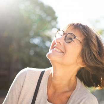 Lady smiles at the sky