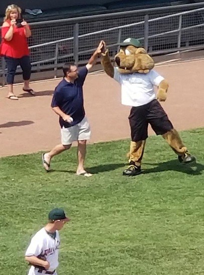 Team members at baseball game