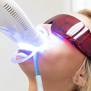 Woman receiving in-office teeth whitening