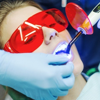 Patient receiving dental bonding treatment