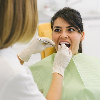 Woman receiving root canal treatment