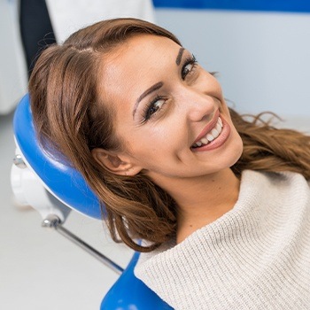 Relaxed woman in dental chair after sedation dentistry