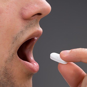 Patient taking dental sedation pill