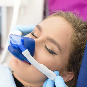 Woman with nitrous oxide sedation mask