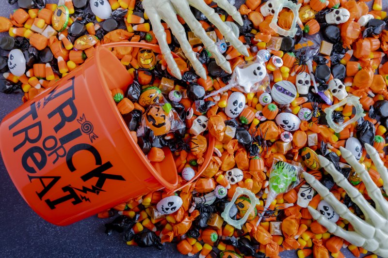 Halloween candy spilling from bucket