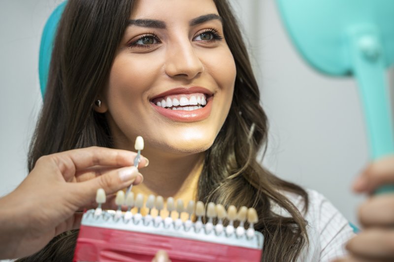 patient smiling after getting dental crown